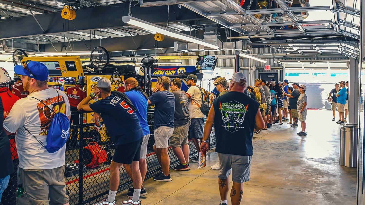 NASCAR fans watch on as teams prepare their cars at Talladega Superspeedway NASCAR fans watch on as teams prepare their cars at Talladega Superspeedway