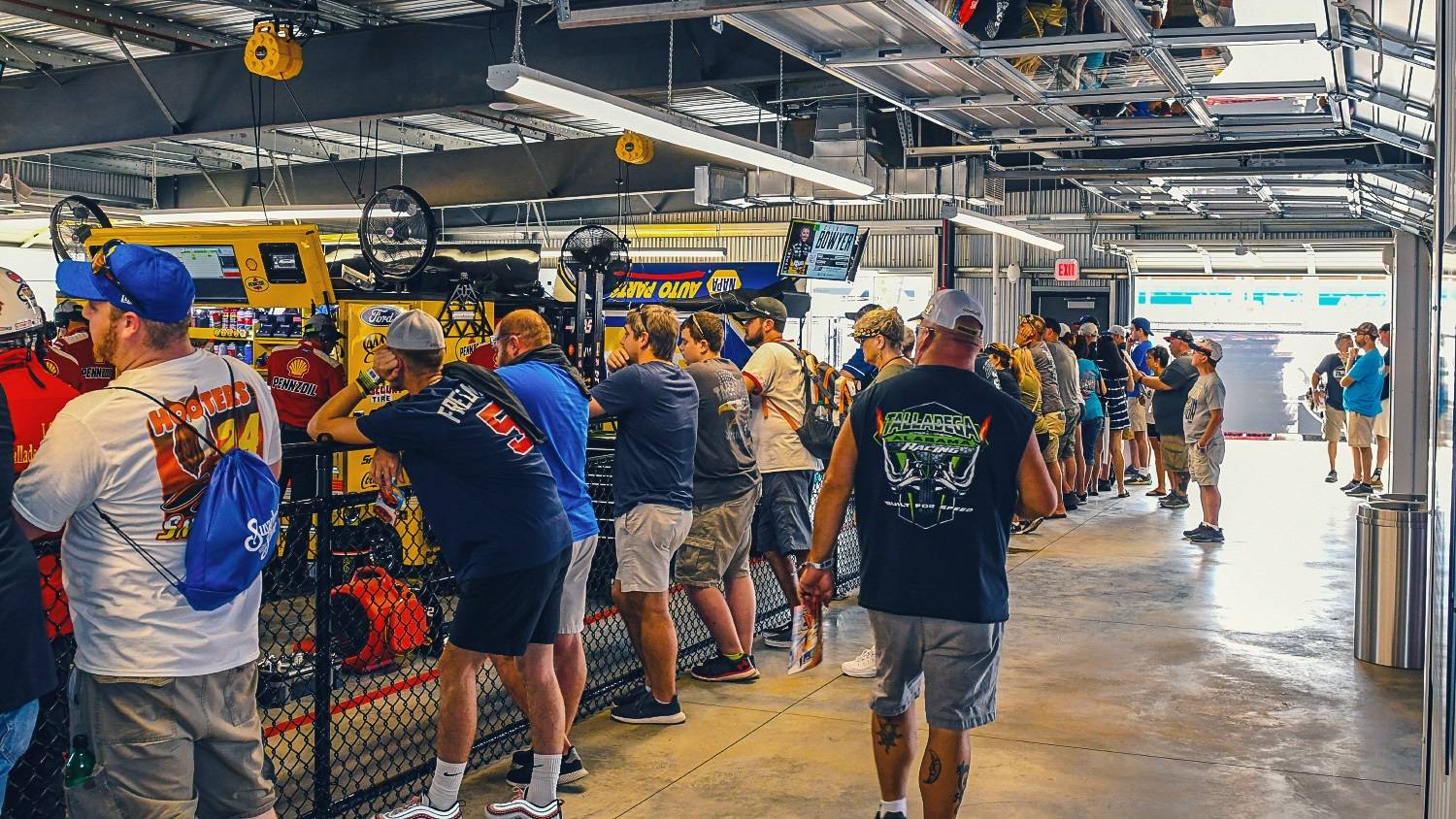 NASCAR fans watch on as teams prepare their cars at Talladega Superspeedway