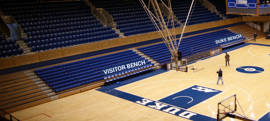 Which seats are behind the Duke and Visitor benches at Cameron Indoor